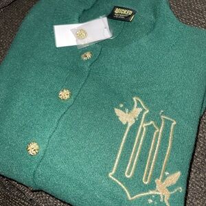 Green wicked cardigan by Paul Tazewell for target. As seen on Ariana grande